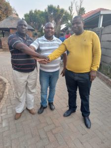 Sergeant  Ramara, victim, Mankwe Raphela (middle)  and his uncle,  former lt colonel Manganye outside Edenvale SAPS 